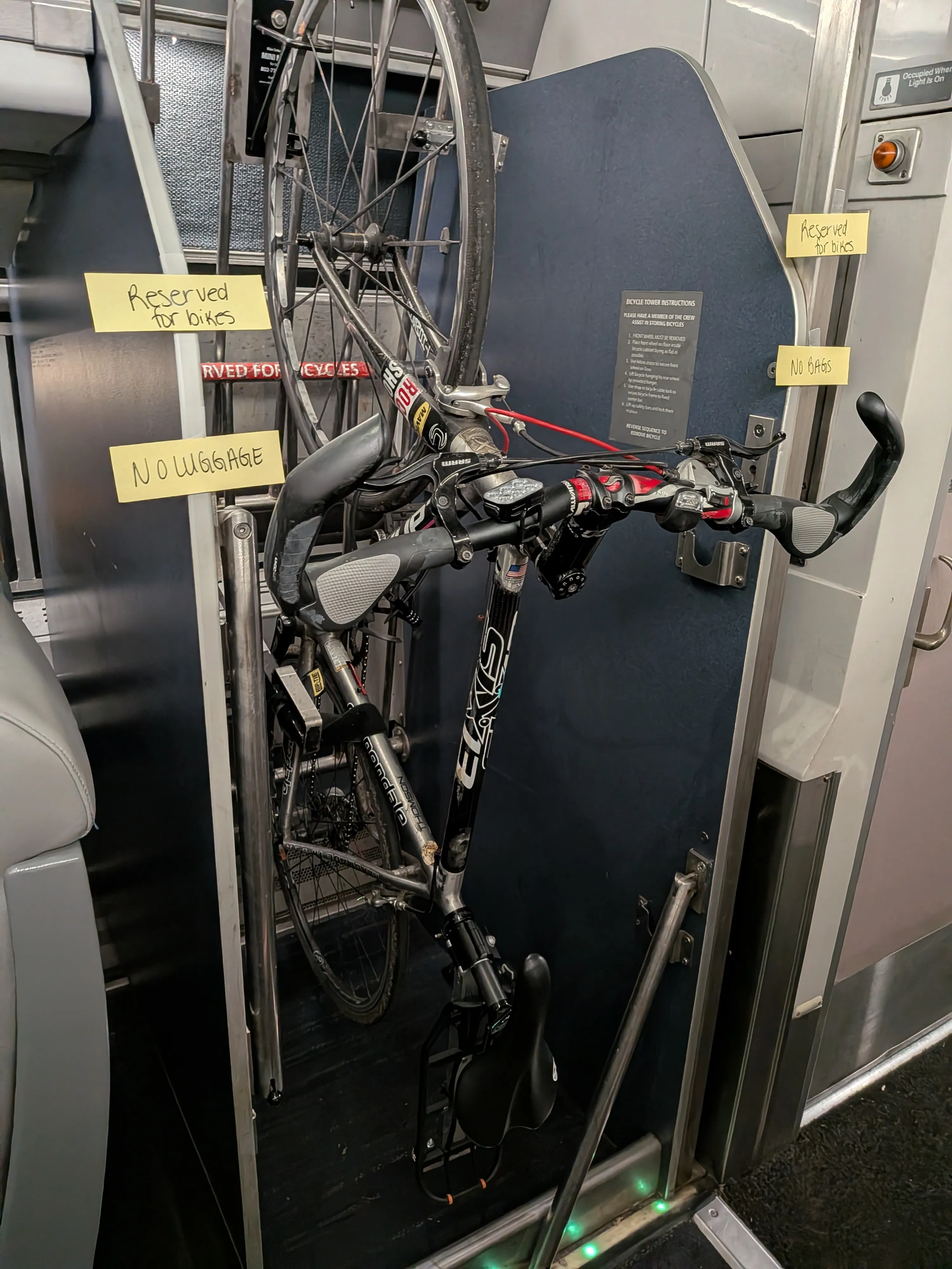 The bike hanging on the rack aboard the Amtrak train north